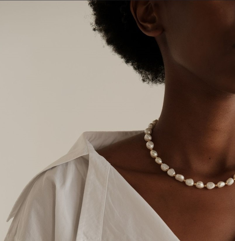 Woman wearing pearl necklace